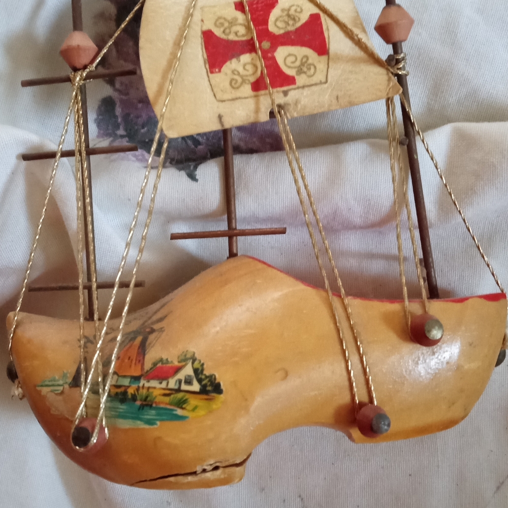 Wooden Shoe Ship Decor with Red Accents